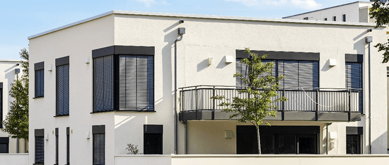 Modern white residential building with balconies
